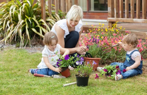 Team finish: safe, insured gardening crew completing a garden task