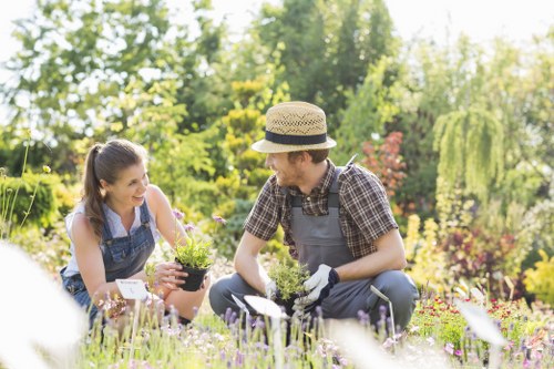 Gardeners wearing protective equipment while working